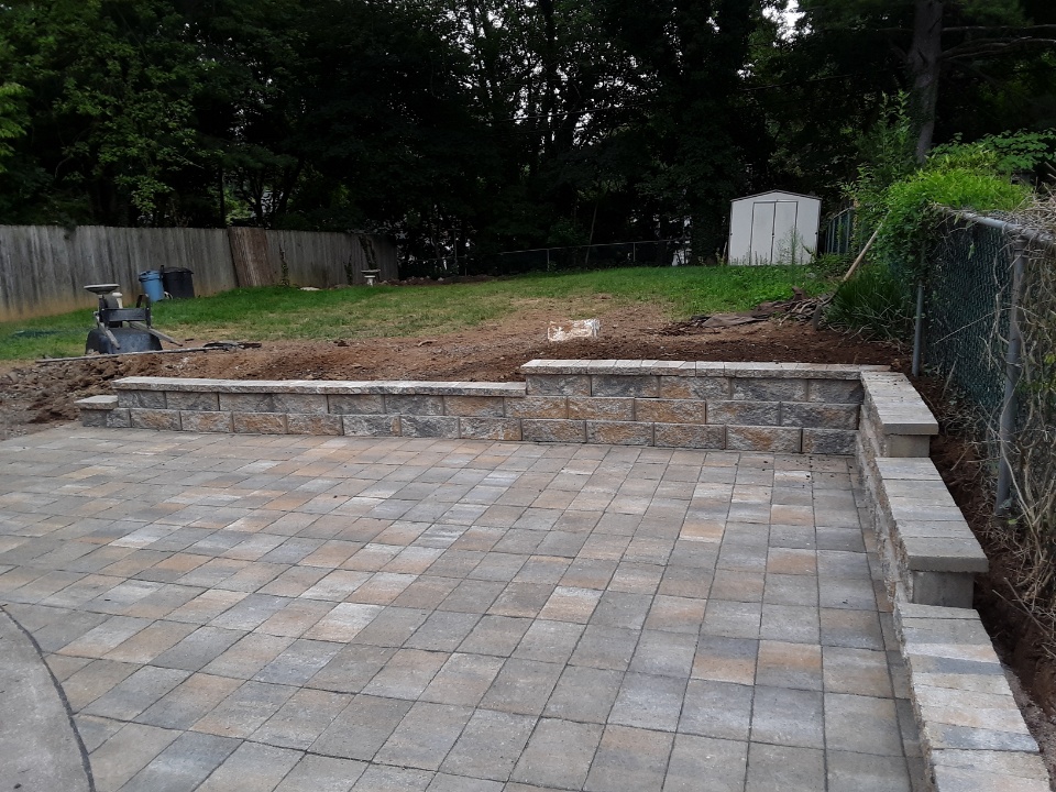 Backyard stone paver patio and landcape grading